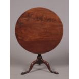 A George III mahogany centre pedestal snap top supper table. Rotating on a bird cage mechanism and