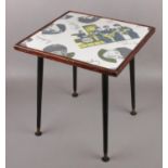 A small occasional table with The Beatles vinyl top and tapering supports.