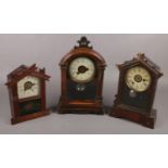 Three American alarm clocks to include mahogany painted glass panel example etc.