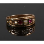 A 15ct gold seed pearl and garnet ring, size M 1/2. (2.32g).