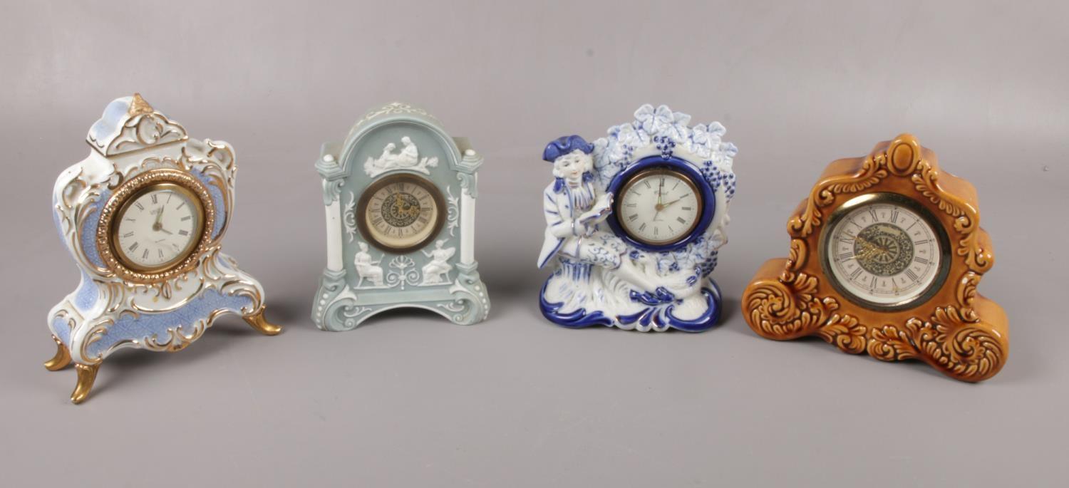 Four ceramic alarm clocks to include, a Landex Royal craft and Coral in china blue and white etc.