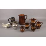 Five copper lustre graduated jugs to include similar examples