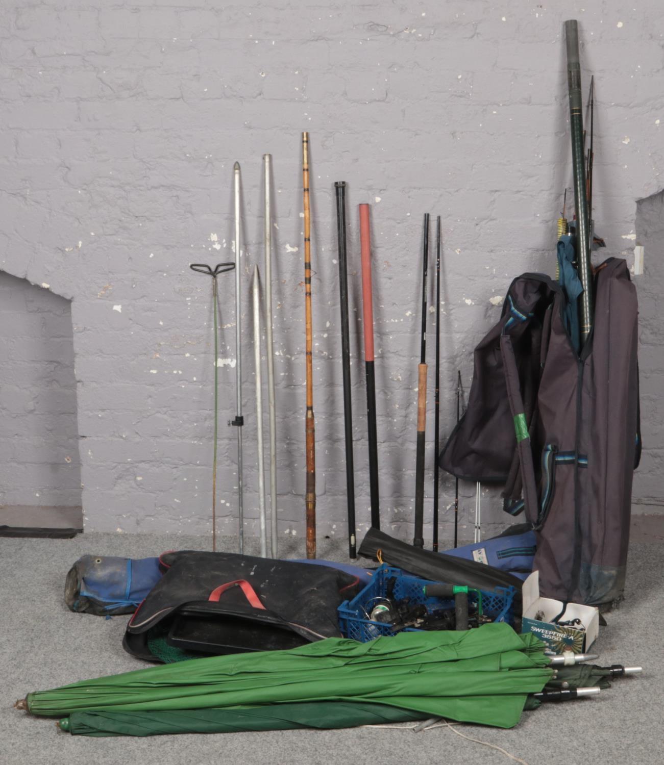 A quantity of fishing equipment to include rods, landing net, rod rest, reels, rod carry bags,