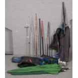 A quantity of fishing equipment to include rods, landing net, rod rest, reels, rod carry bags,