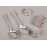 A collection of mostly silver to include two silver spoons, silver bottle top, silver sovereign