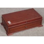 A mahogany cased hot plate.