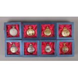 Eight boxed decorative quartz pocket watches.