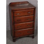 A panelled oak chest of 4 drawers. (91cm x 61cm) Knocks and scratches to wood. Veneer missing and