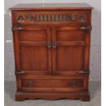 A carved oak old charm music cabinet. (103cm x 85cm)