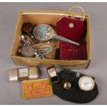 A box of collectables, to include musical lighter, clocks, silver plate cutlery etc.