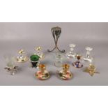 A selection of metal and glass candle stick holders to include, a pair of brass candle stick holders