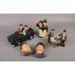 A group of Laurel & Hardy ceramic figures, bust wall plaques, in black car, on telephone, examples