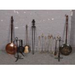 A group of mainly brass fire compendium tools, coal shovel, fire brush etc to include two copper bed