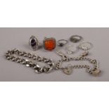Six silver dress rings, to include amber and Blue John examples, along with a silver charm