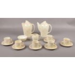 An Art Deco Susie Cooper polka coffee set, coffee/tea pots, milk jug, sugar bowl, cups/ saucers No