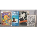 A psychedelic The Beatles A is for Apple The Fool poster, along with three Wings posters.