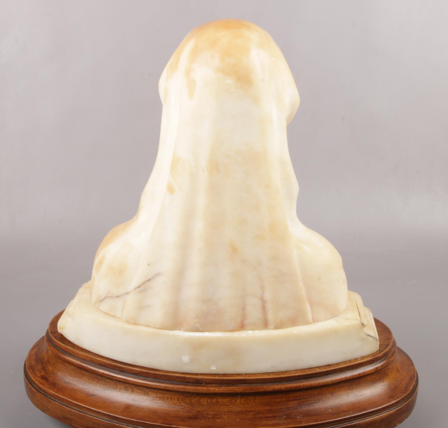 An alabaster bust of the Virgin Mary, raised on wooden plinth. (Total height 38cm). - Image 3 of 3