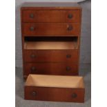 A oak chest of 5 drawers. (113cm x 85cm) One drawer swollen and doesn't fit.