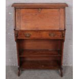 A small oak bureau with fitted interior. (110cm x 75cm)