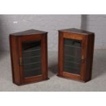 Two Mahogany glazed corner cupboards, ( 65cm height, 38cm width, 27cm depth)