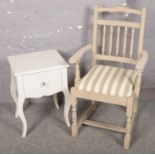 A modern painted bedside cabinet along with a painted spindle back chair.