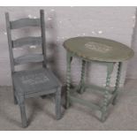 A painted ladder back chair along with a painted barley twist occasional table, both pieces