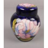 A Moorcroft tubeline decorated 'Magnolia' lidded ginger jar, 11.5cm height, impressed marks to base.