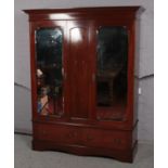A Victorian inlaid mahogany double mirror front wardrobe with 2 drawer base. (164cm x 208cm)