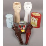 A group of a collectables to include ceramic face vases, wooden novelty nut crackers, Corgi Noddy'
