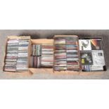 Four small boxes of CDs, various genres.