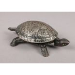 A clockwork cast metal bell in the form of a Tortoise.