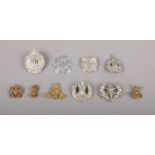 A collection of ten military cap badges, to include Argyll & Sutherland, King's Own Scottish