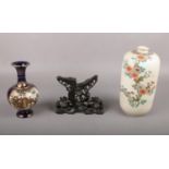 Two 19th century Japanese Satsuma vases together with a floral hardwood stand.