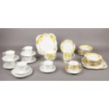 A Royal Grafton Bone China part Tea set with floral pattern to include plain white tea set.