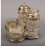 An assembled Victorian silver and glass cruet set, the stand assayed Sheffield 1865 by Martin,