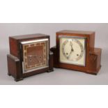 Two Art Deco carved oak 8 day mantel clocks, one by Bentima, both with pendulums.