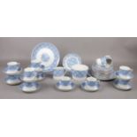 A Early 20th Century blue & white tea set with gilt borders, cups/saucers, tea plates, milk jug etc