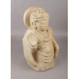 A hand carved stone figure of an Indian Deitie, (39.5cm height).