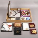 A tray of of cased dress jewellery to include ruby pendant & earrings set, garnet bead set, gilt