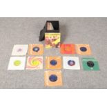 A carry case collection of mostly 60's and 70's vinyl Rock singles to comprise of, The Beatles,