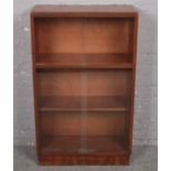 A mahogany bookcase with glass sliding doors. (66cm x 110cm x 28cm) along with another.