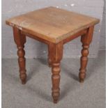 A pine scrub top table. (79cm x 69cm) Top bowed.