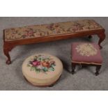 Three wooden foot stools, upholstered in a floral tapestry style in various sizes, comprising of a