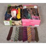 Two boxes of designer ties, pocket squares and scarfs in a variety of materials but mostly in