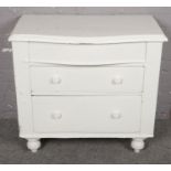 A Victorian white painted pine chest of three drawers. (85cm x 93cm)