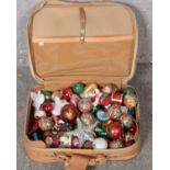 A suitcase of Christmas tree baubles.