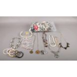 A large collection of costume jewellery to include, a selection of plastic and metal necklaces and