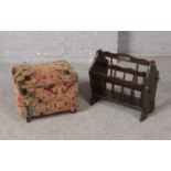 An upholstered footstool and wooden magazine rack