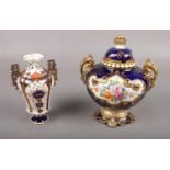 Two Royal Crown Derby twin handled vases, to include one vase hand painted with floral decoration