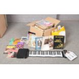 A Roll-up Piano with instructions and Piano and keyboard CD-Rom Piano workshop, together with a